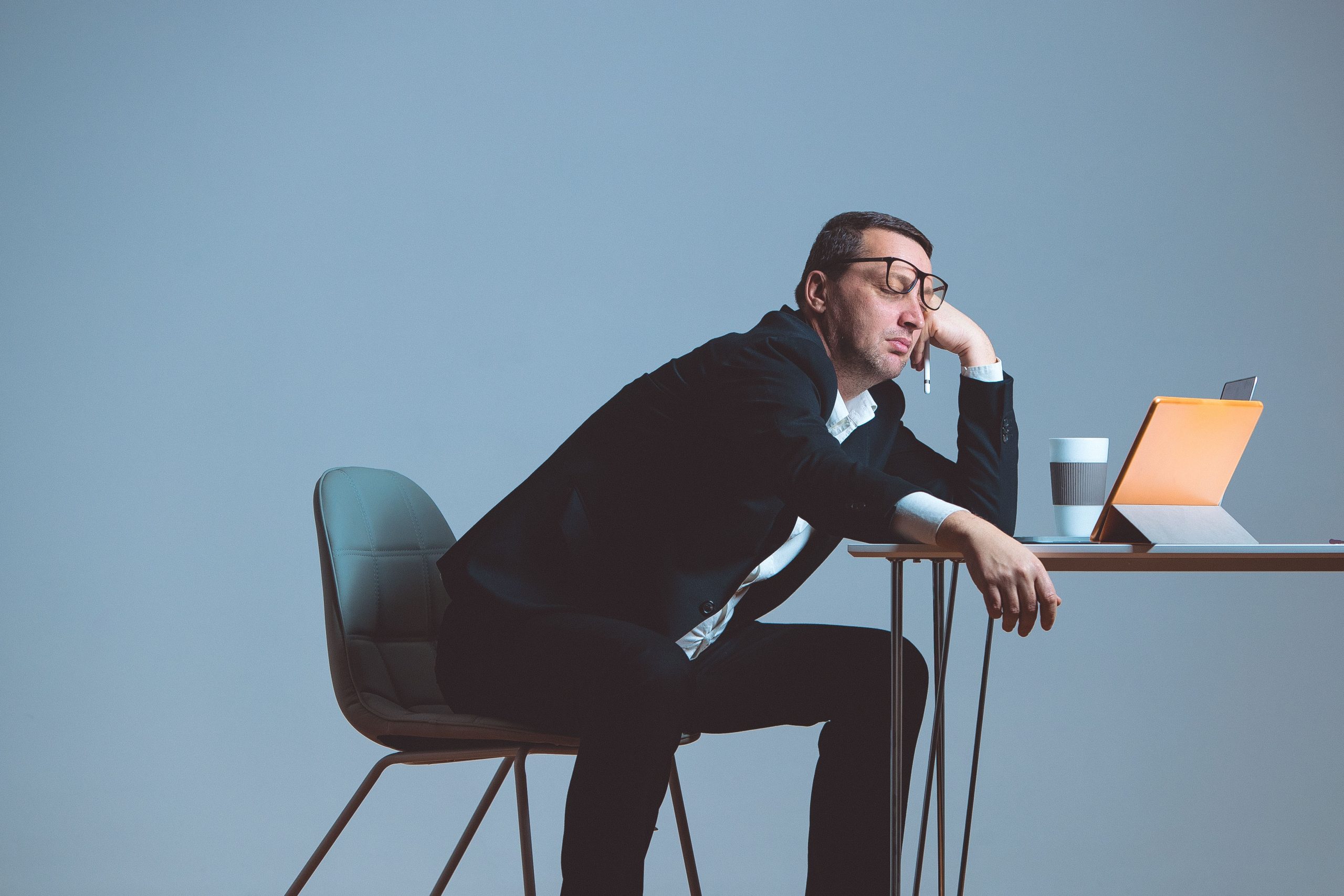 Funny businessman sleeping in the office